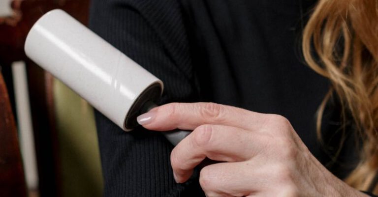 OCD - Woman in Black Long Sleeve Shirt Holding a Lint Roller