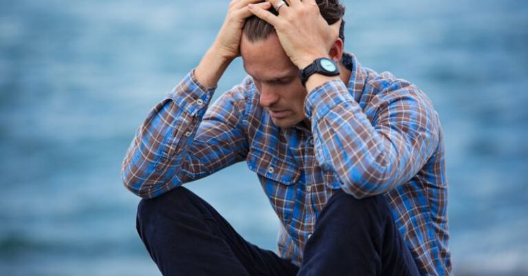 Depression - Man in Blue and Brown Plaid Dress Shirt Touching His Hair