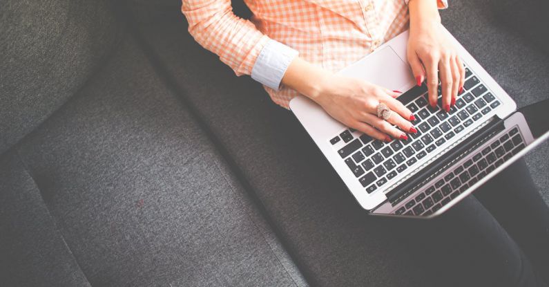 Plan - Person Sitting on Gray Sofa While Using Macbook