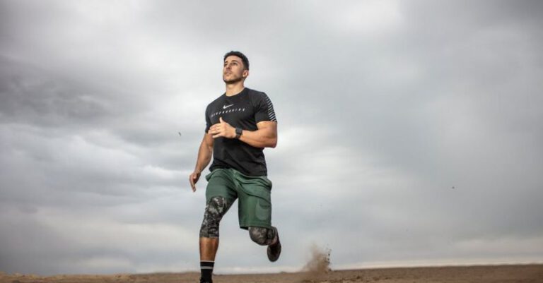 Exercise - Man Running on Sand Field