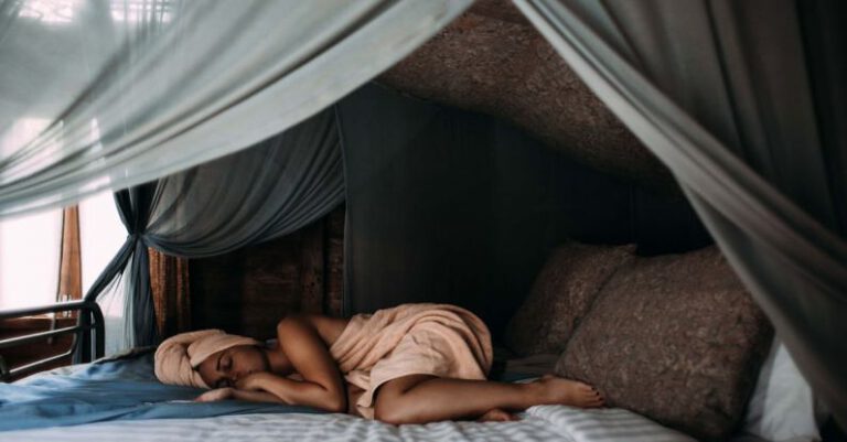 Sleep - Woman Lying on Bed wrapped around a Towel