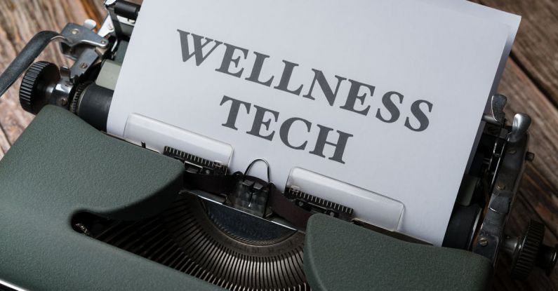 Biofeedback - A typewriter with the word wellness tech on it