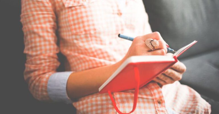 Journaling - Person Writing on Red Notebook