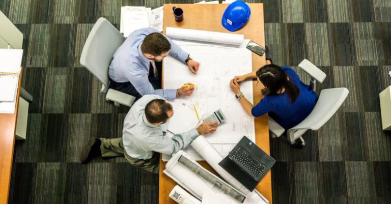 Plan - Three People Sitting Beside Table