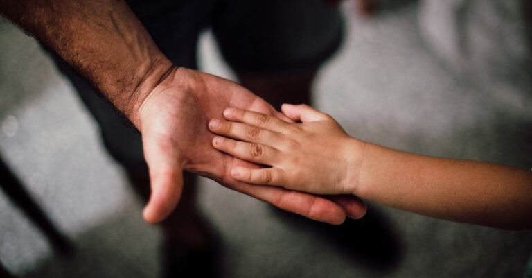 Support - Father and Child's Hands Together